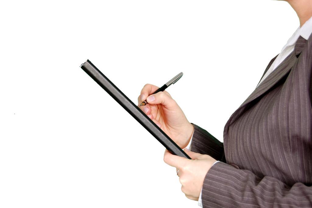 白色商务简练职业经理人做笔记工作照而毕竟图片