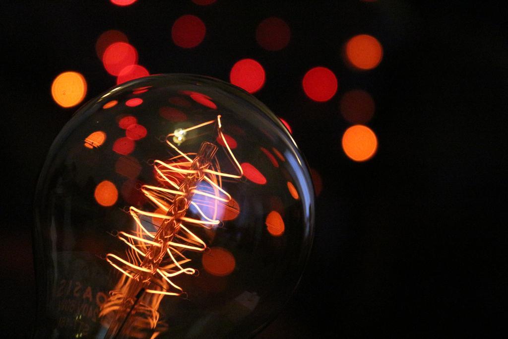 工业电力家居装饰照明灯泡玻璃钨丝光亮艺术背景图片