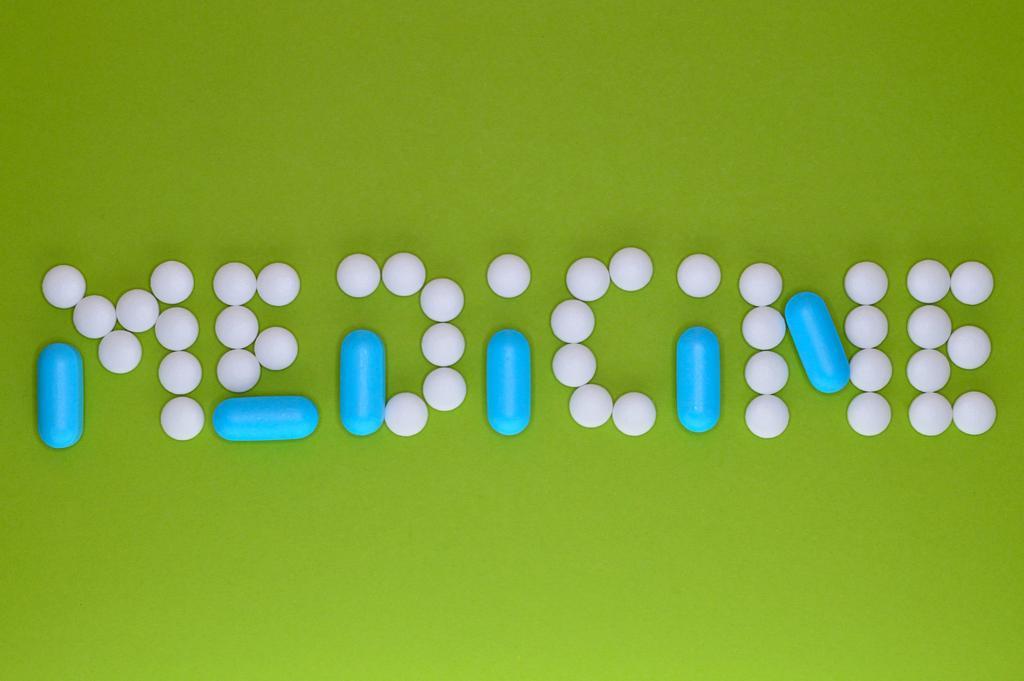 设计创意药丸字母图案背景图片