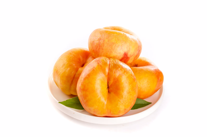 白底摆放着黄油蟠桃