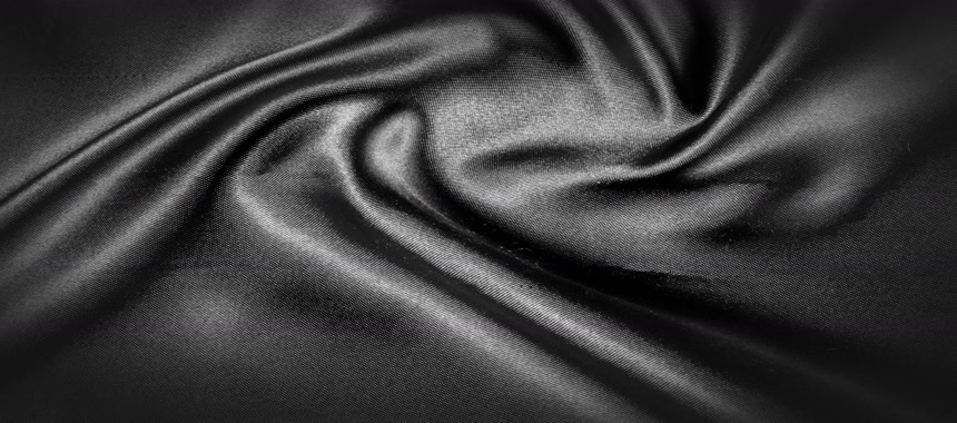 纹理，背景，图案。黑色丝织。它是黑色的黑色丝绸 装饰背景