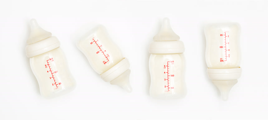 baby bottle with milk on white background婴儿奶瓶生活方式