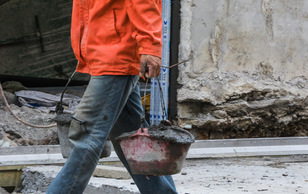 劳动工人水泥浆背景图片