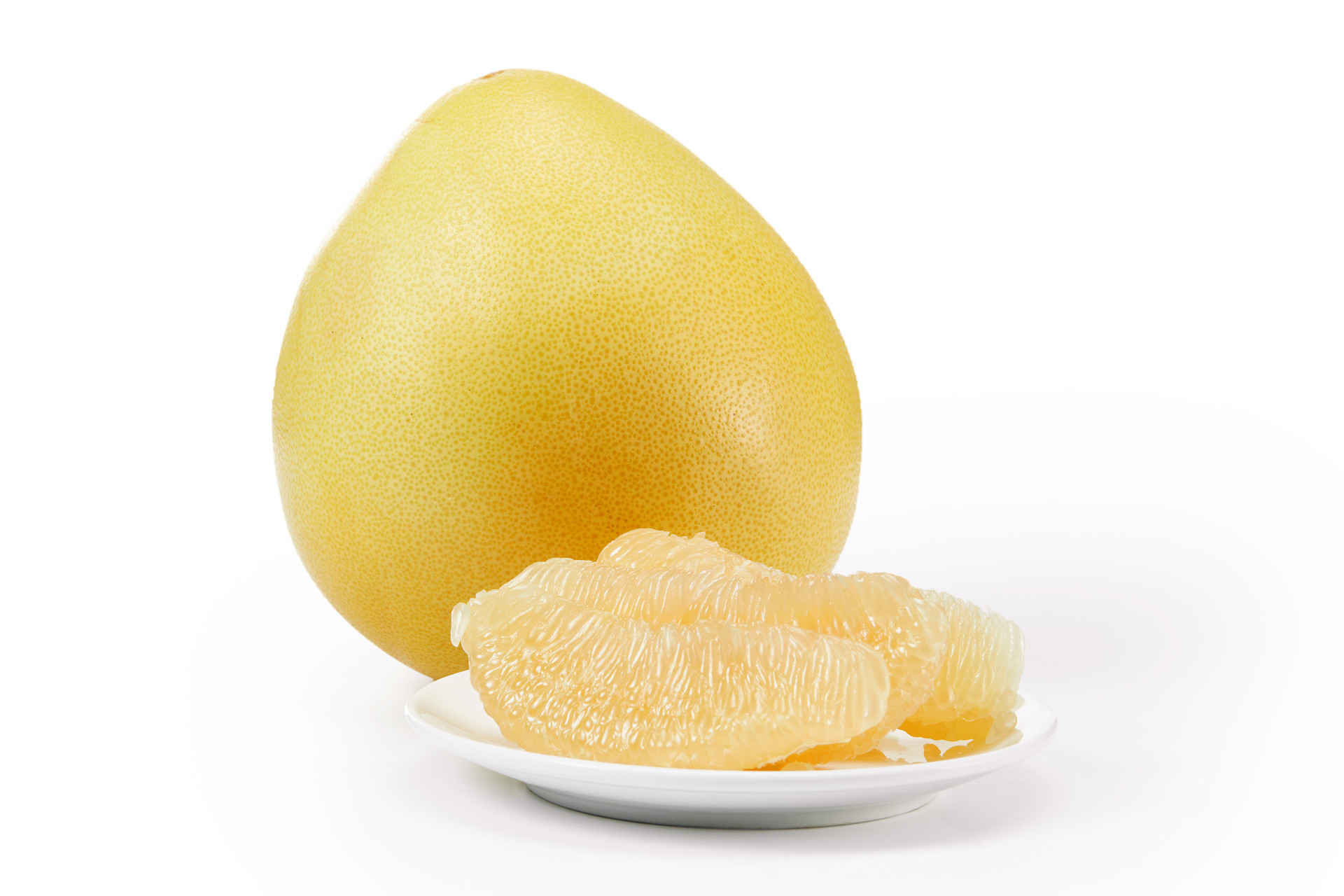 白底水果柚子几瓣柚子一盘柚子剥开柚子