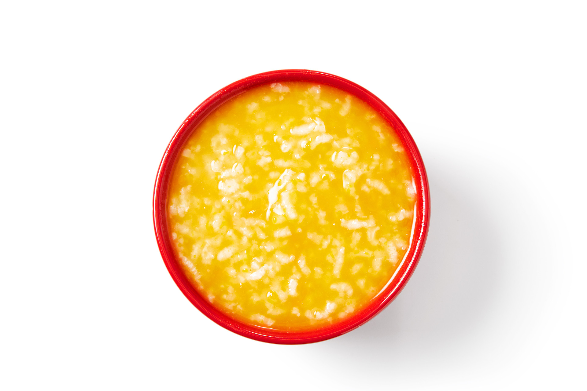 俯视图白底红碗南瓜粥大米粥一碗米粥