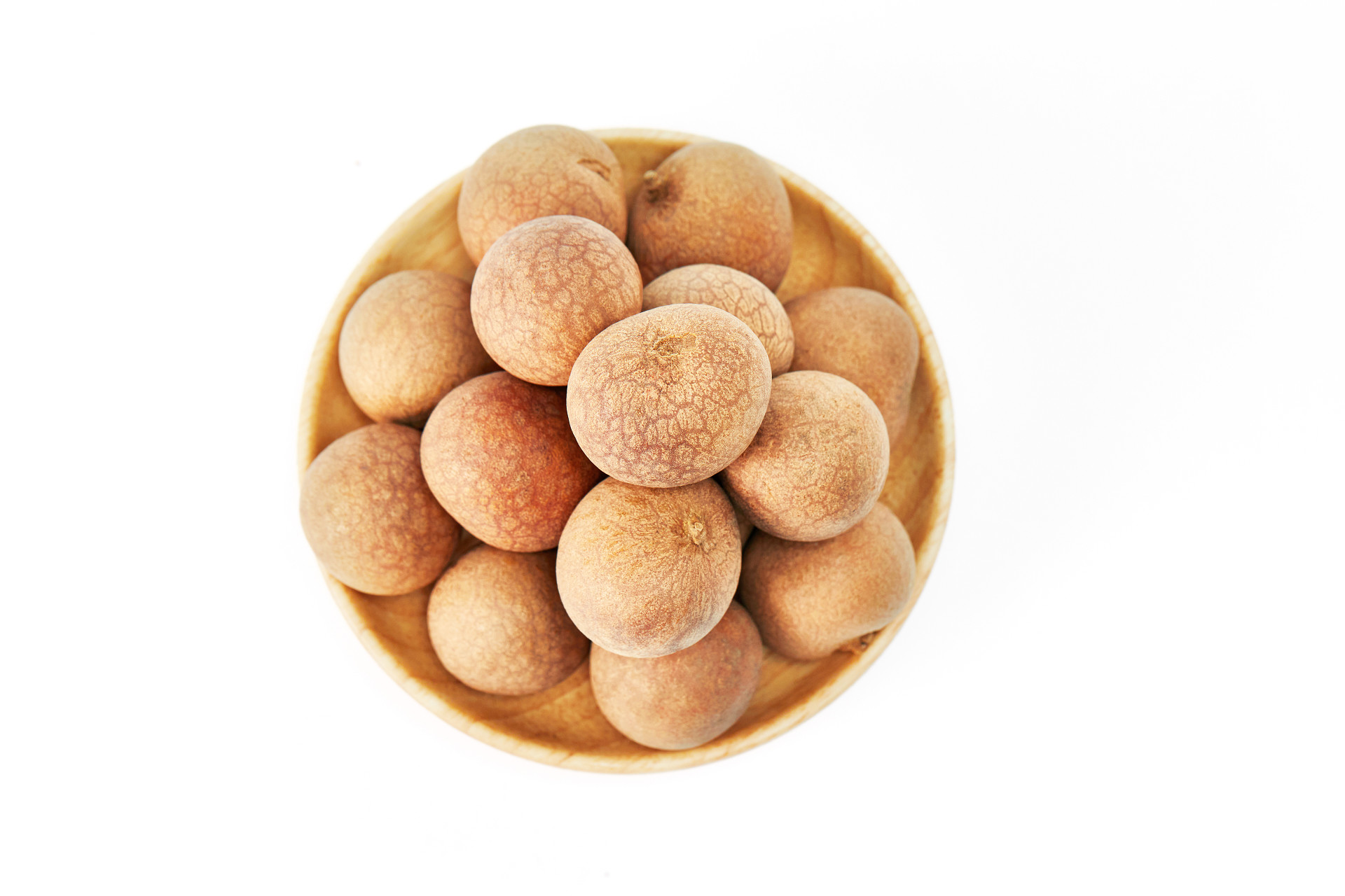 俯视图白底木盘一盘桂圆一盘龙眼水果营养