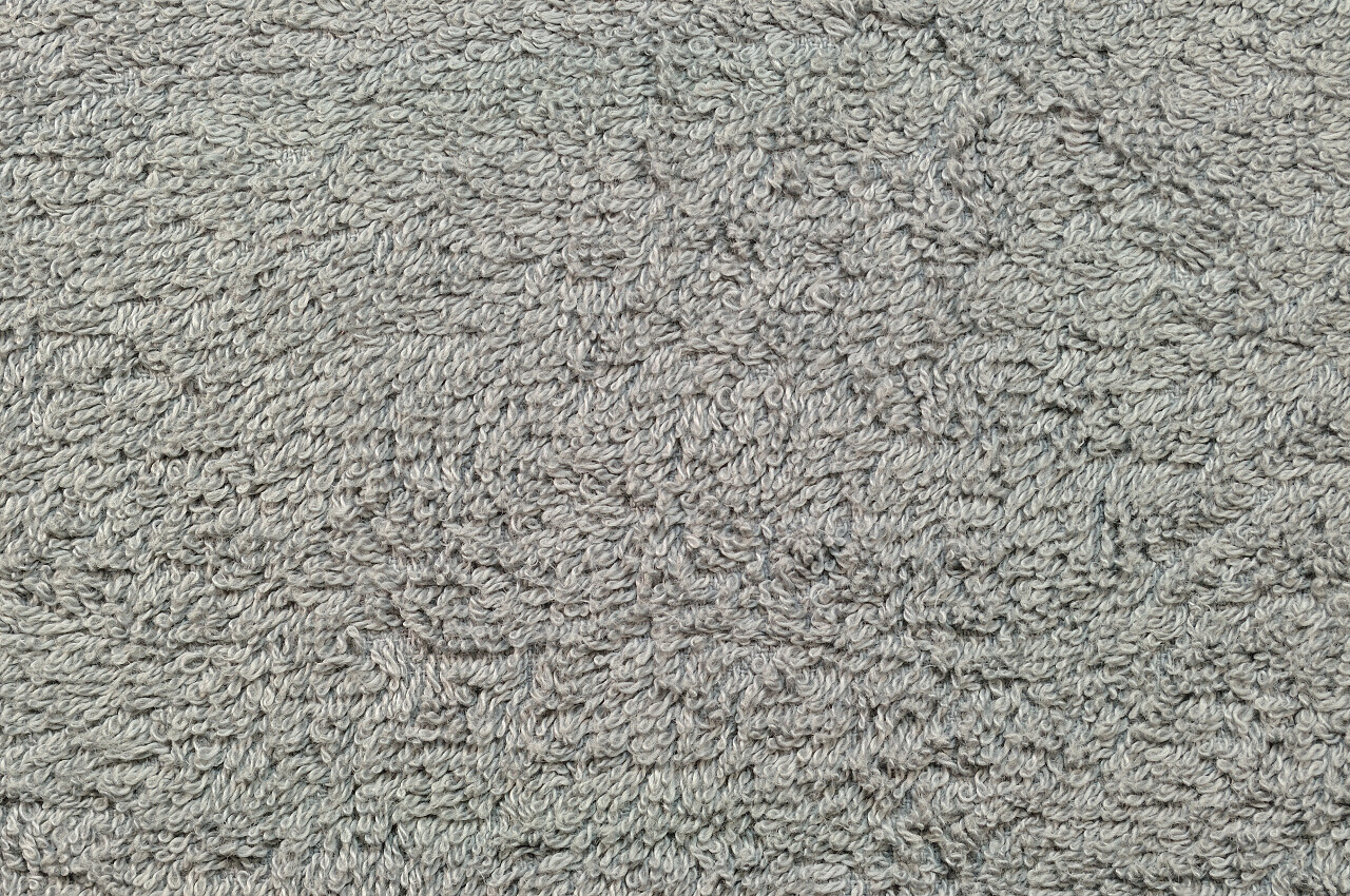 灰色自然毛绒毛巾布土耳其浴沙滩巾  纹理的织物宏观背景特写纹理图案