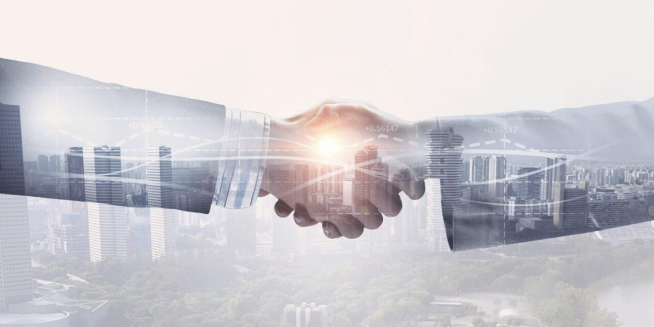 在背景下的商业握手的特写合作团结握手企业团结团结合作平台商务合作握手