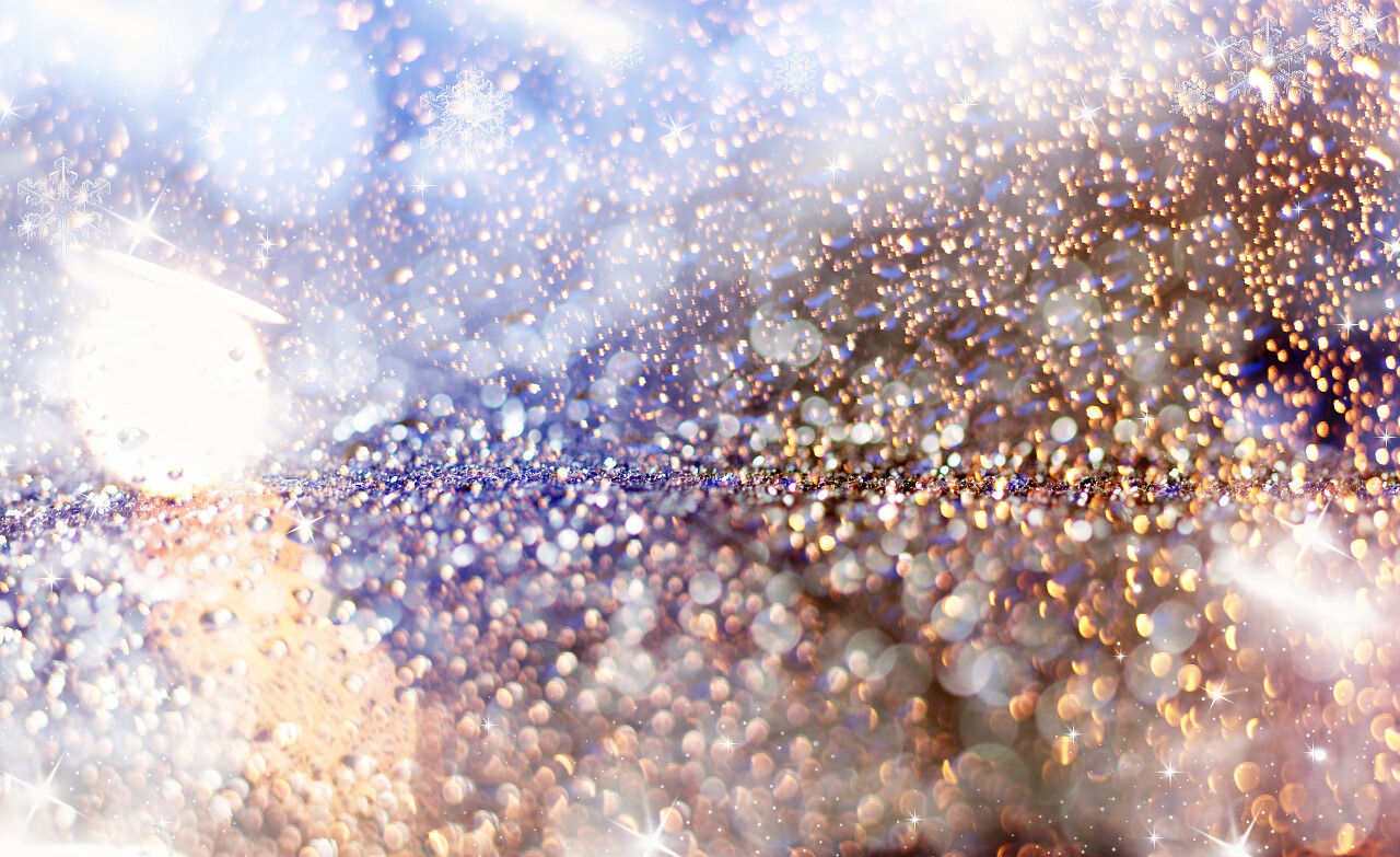 魔法蓝色假日抽象闪光背景闪烁星星与纷飞的大雪