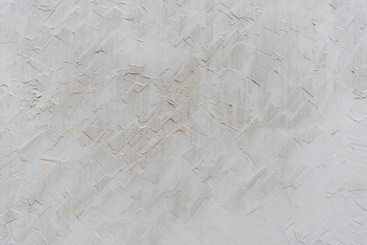 空白的灰色薄抹灰的外墙背景