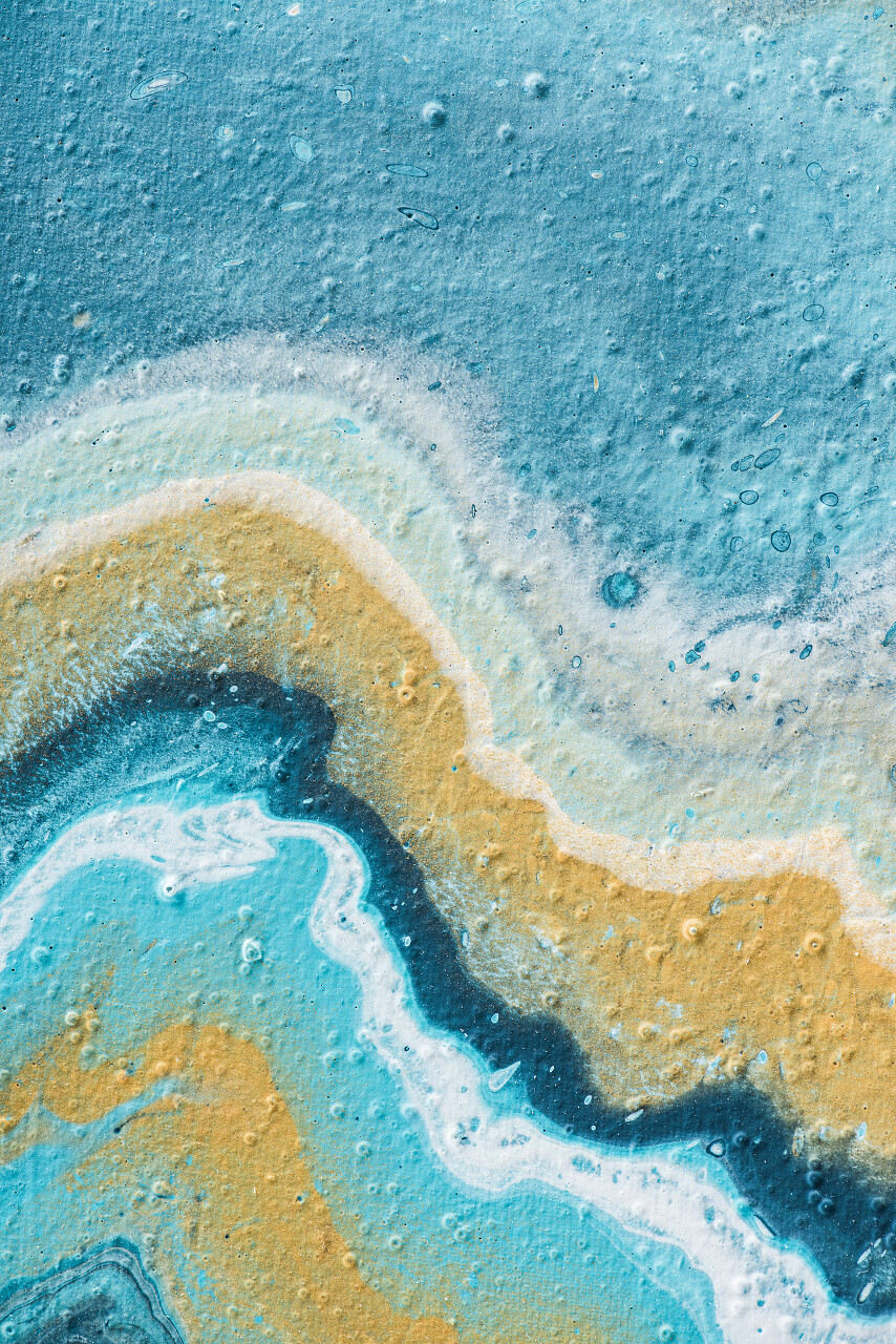 浅蓝色和黄色丙烯酸漆的抽象背景