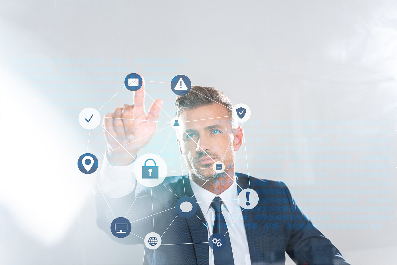 英俊的商人触摸技术图标与手指隔离在白色人工智能的概念