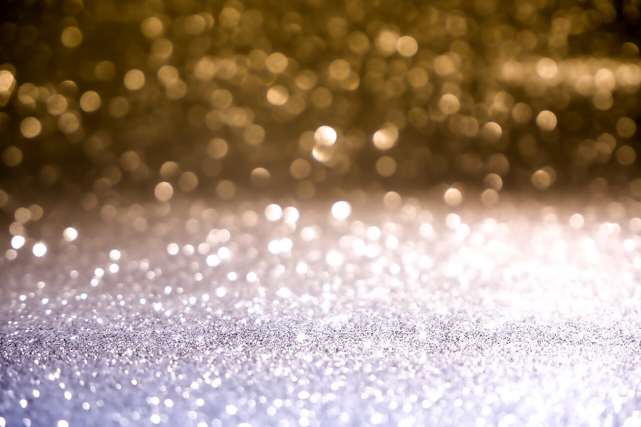 蓝色和黄色的圣诞假背景纹理抽象的明亮的星星