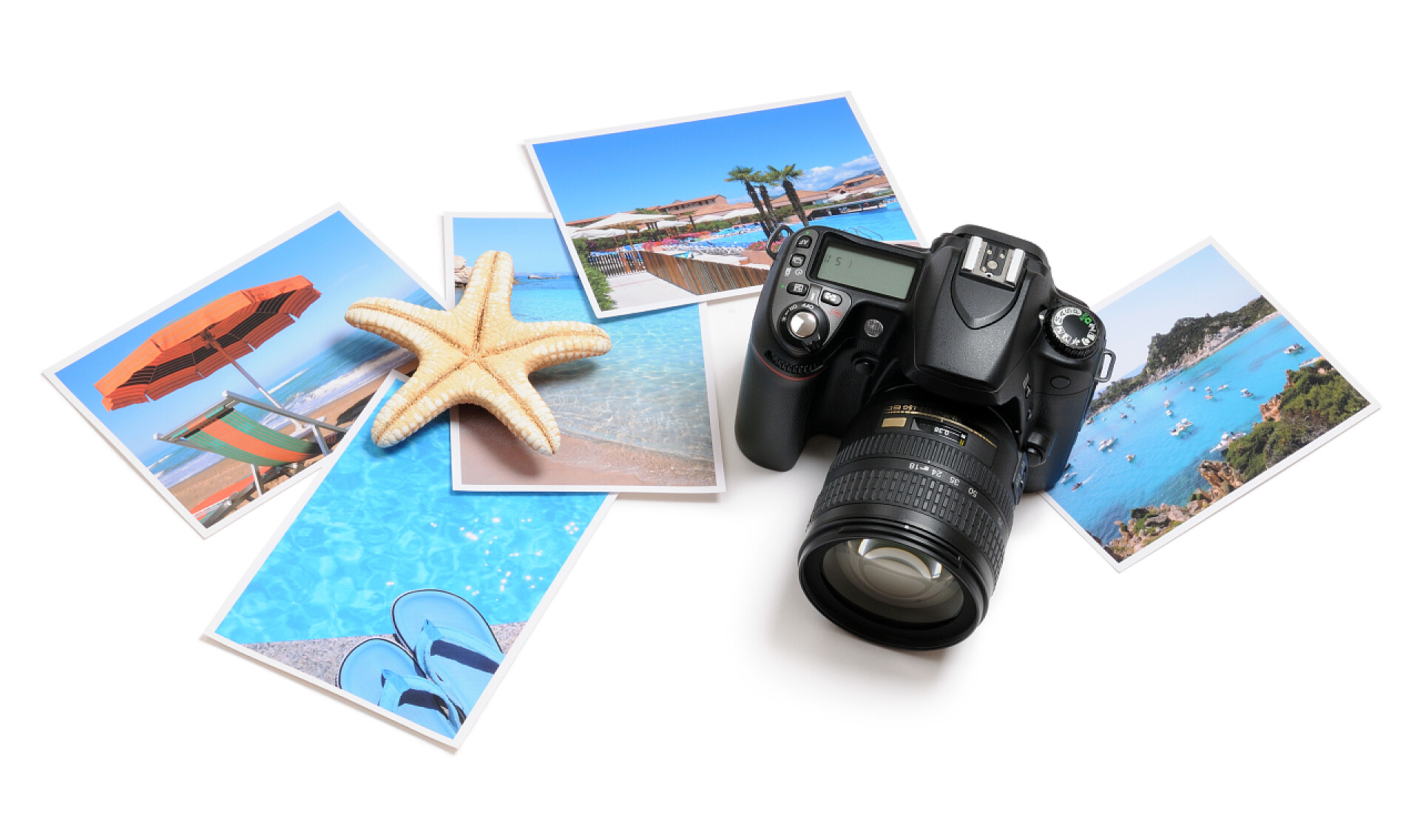 白色桌子上的相机还行和海边图片海上度假