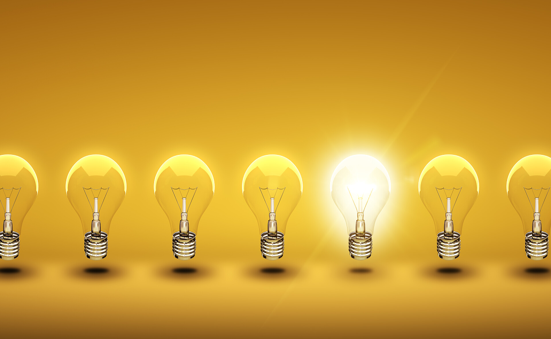 一排发光的灯泡电灯泡