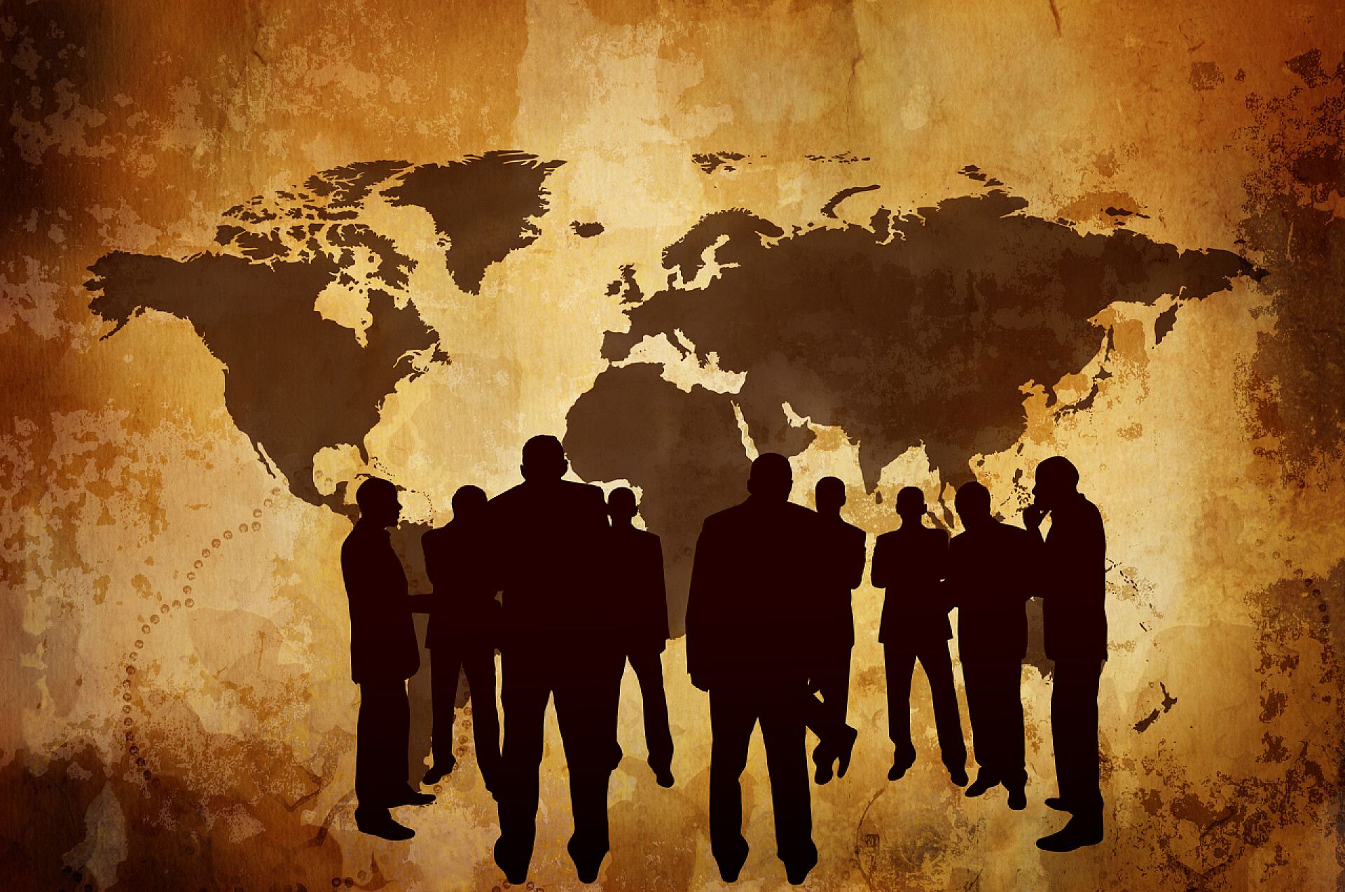 世界地图背景上的人物剪影商业概念或影子经济
