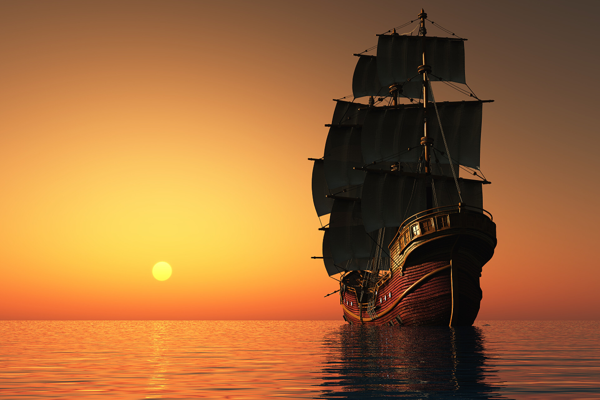 落日时分在海中航行的船帆船