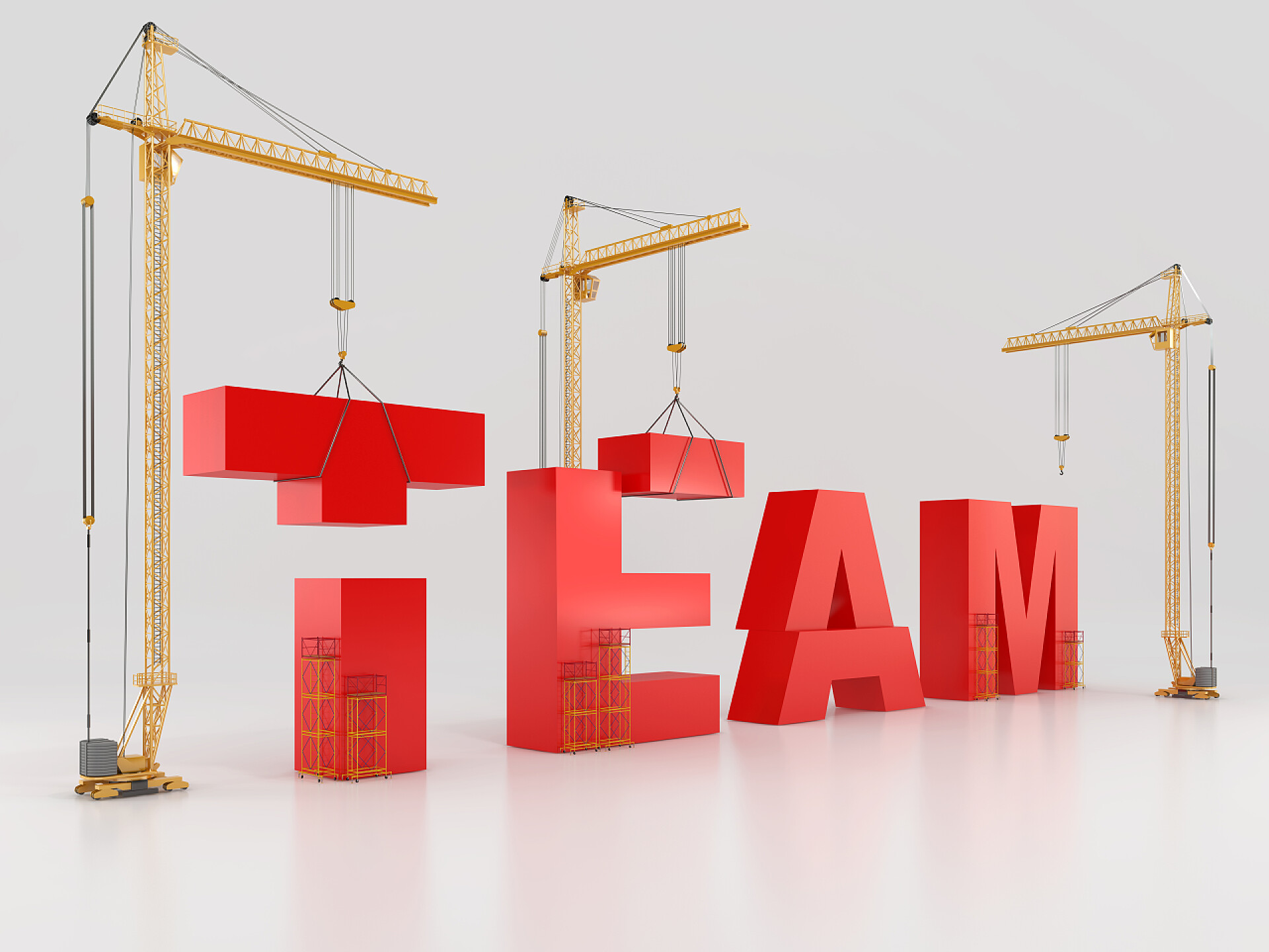 三个黄色脚手架吊起红色字母团队建设.