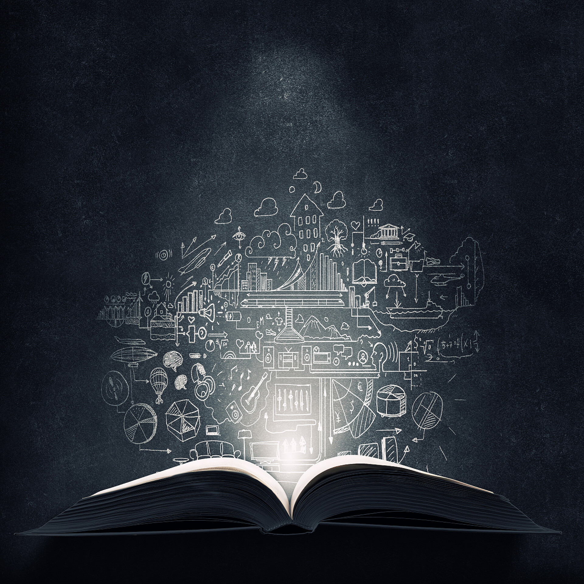 一本翻开的书显示出全息图教育的明亮的光