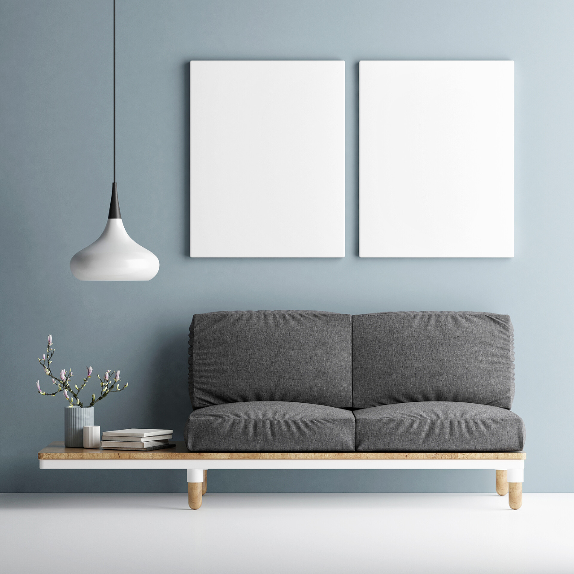 3d渲染的客厅效果图沙发上用两个模拟了蓝色的墙上的海报