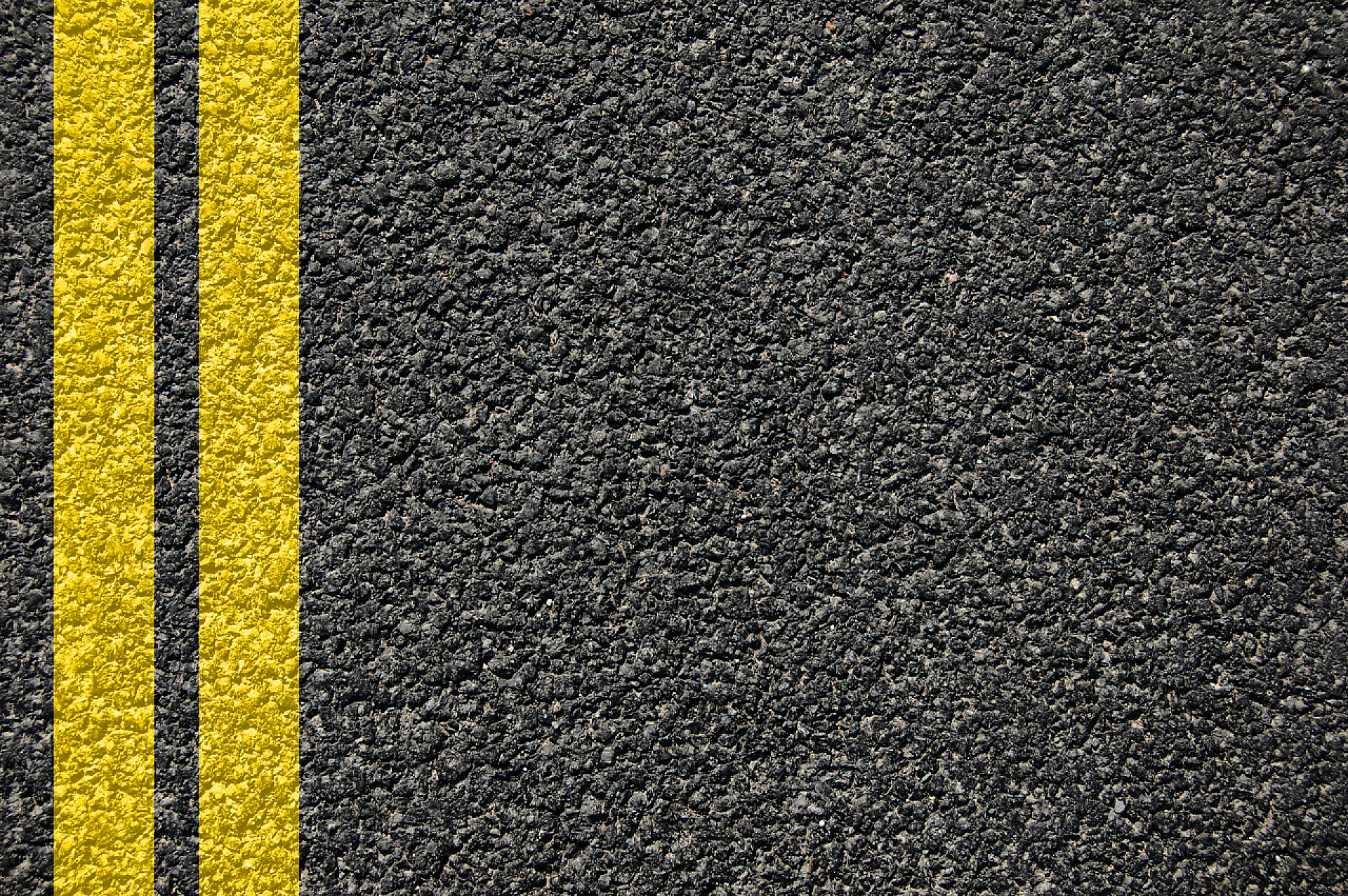 公路上的双黄线背景行路纹理