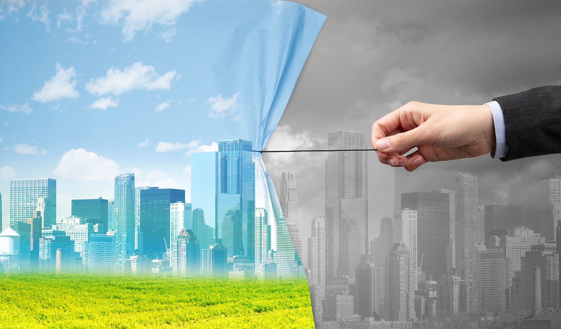 一个男人的手用线拉开一块布呈现出污染和没有污染的环境手拉绿色城市景观帷幕到灰色城市景观