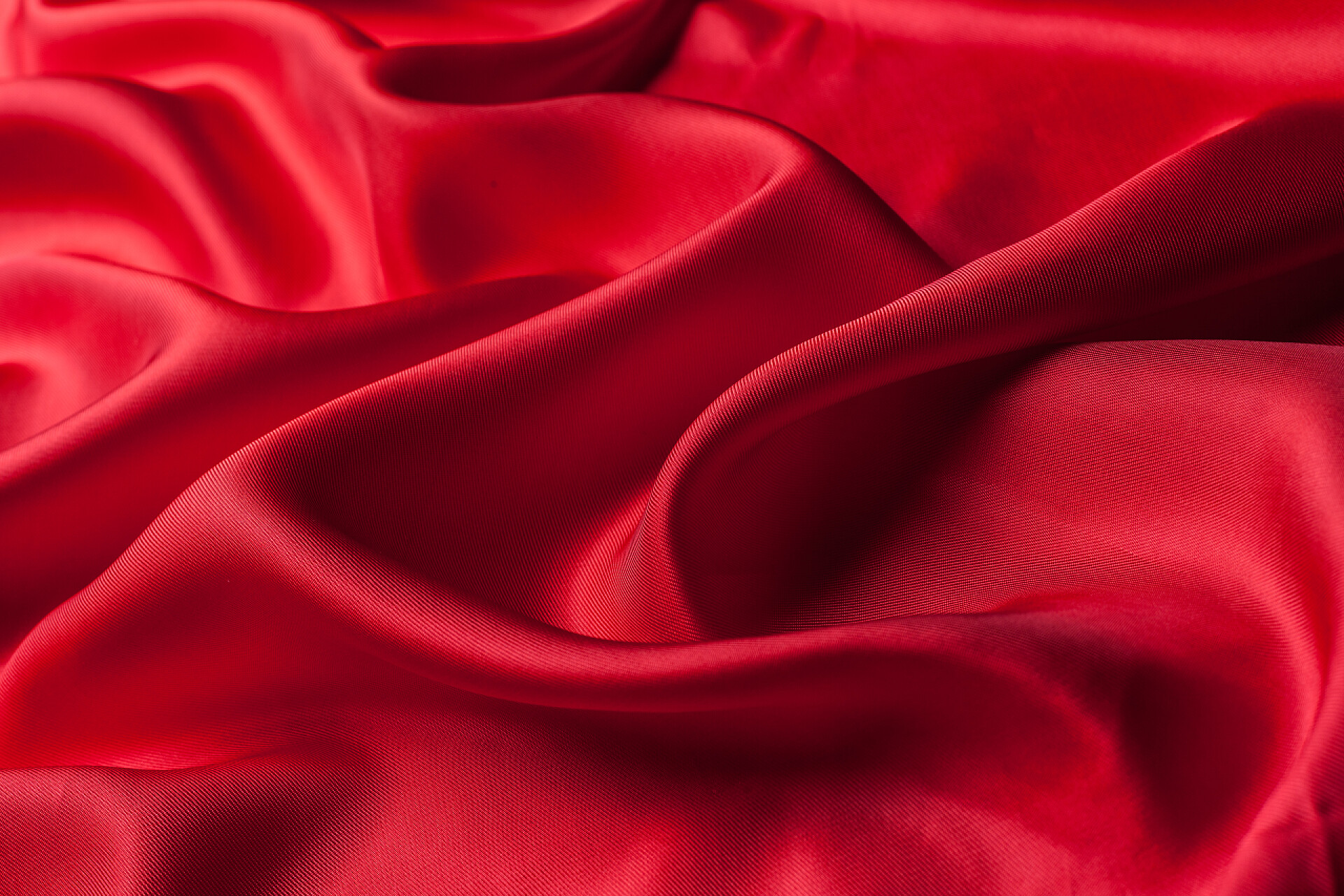时尚的红色布料背景明亮的红色布料波浪纹理, 特写   