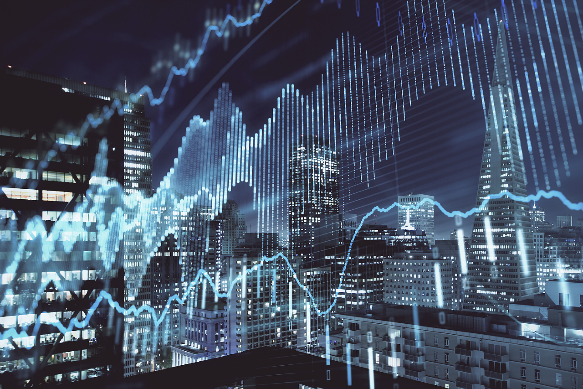 虚拟与现实的结合高楼大厦和曲线图科技背景金融图上夜市景观与高楼背景多重曝光。分析概念.