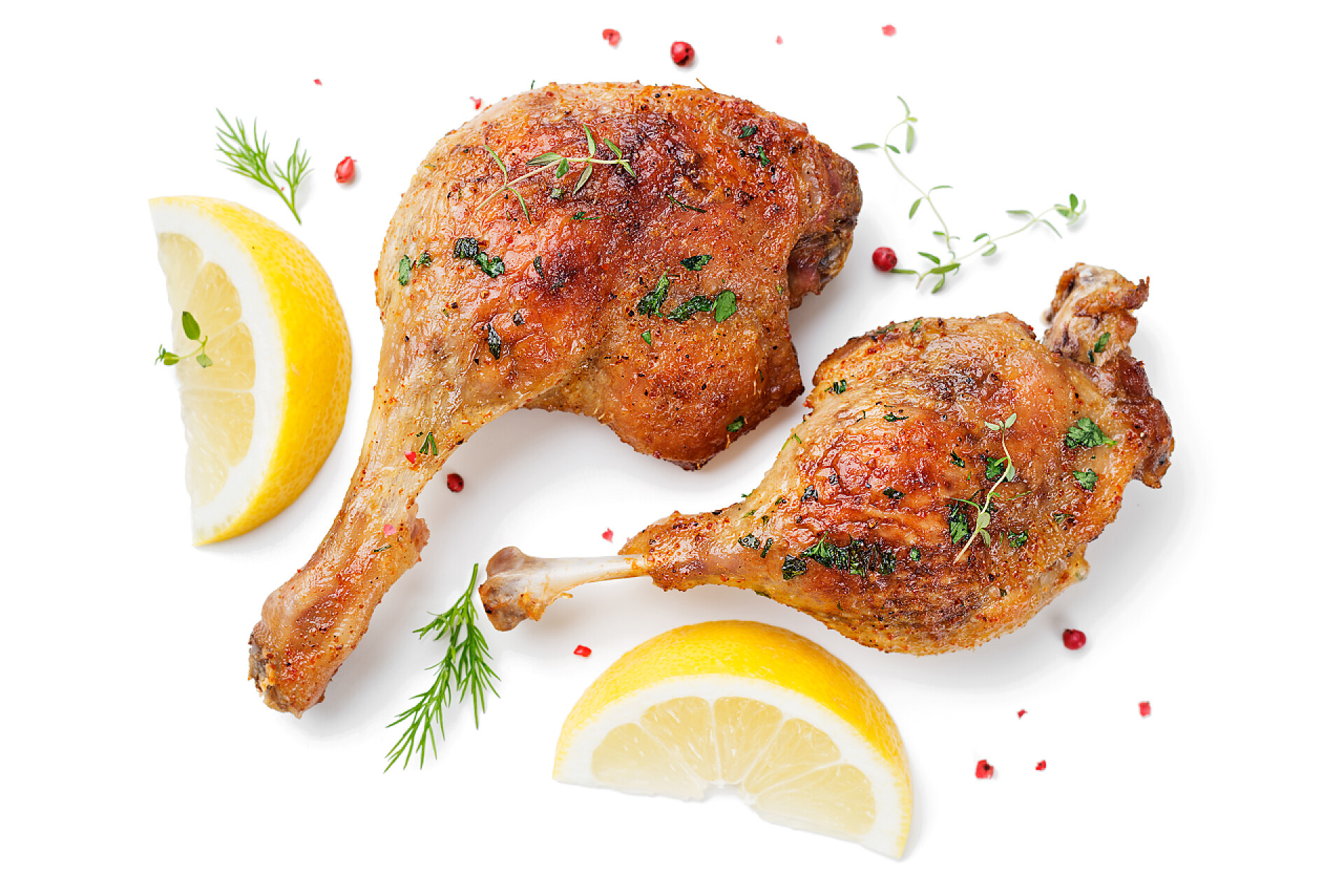 白色桌子上的两个鸡腿烤鸭腿，白色背景隔离