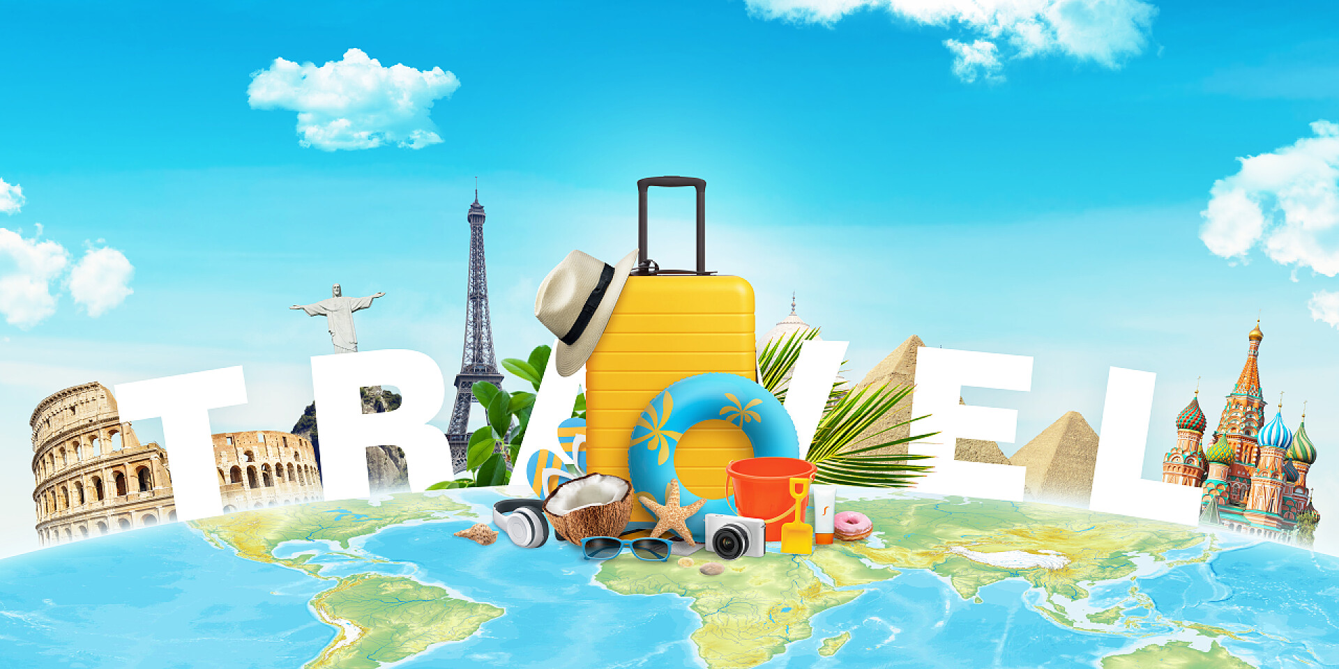 蓝天下的地球旅游世界著名建筑前的黄色旅行包及配件