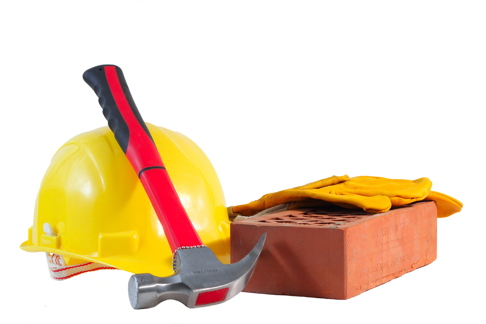 安全生产月安全生产白色背景上的安全帽手套锤子和红砖建筑工具安全生产
