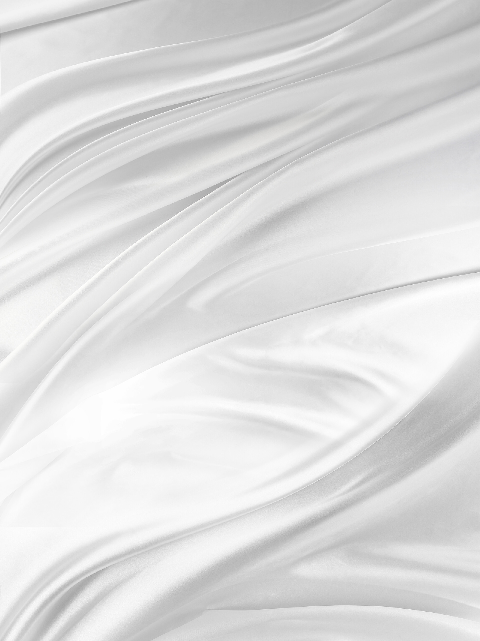 波纹状的白色丝织物背景特写