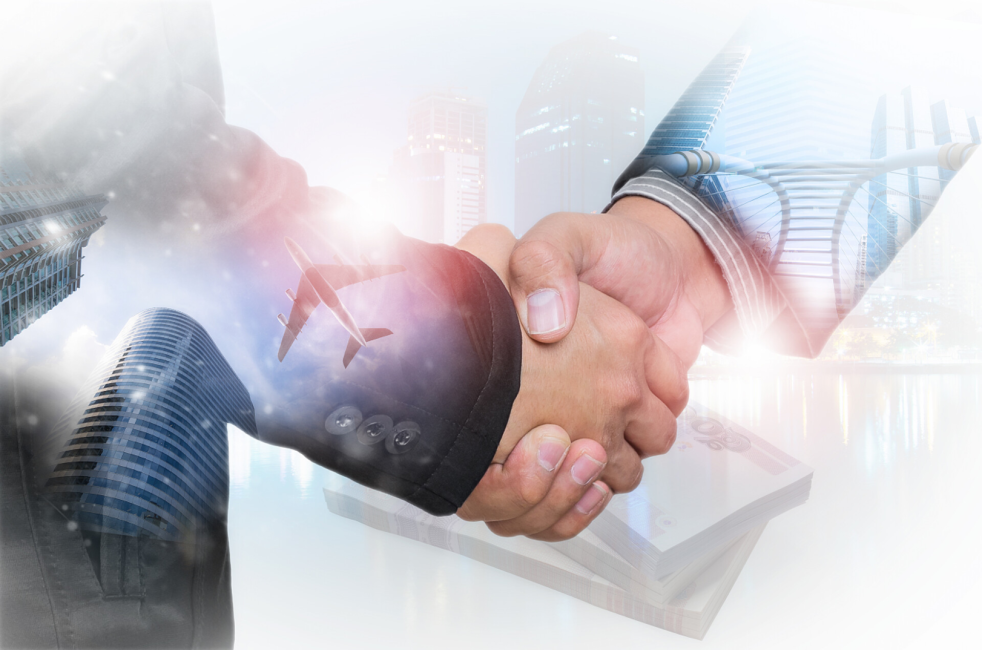 商务城市背景上商人握手商务合作双重曝光