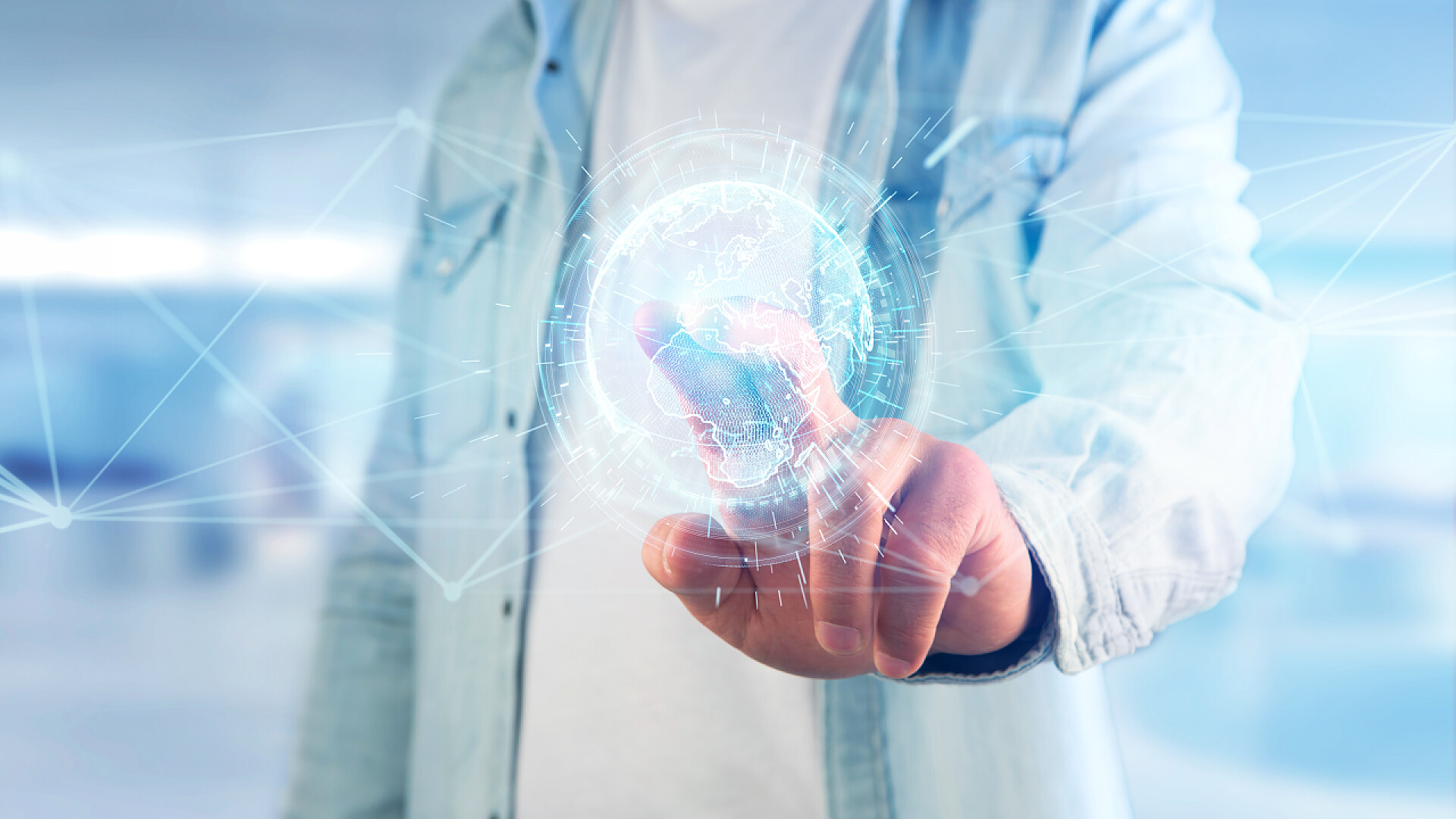 商务商人用手指触摸数字信息地球