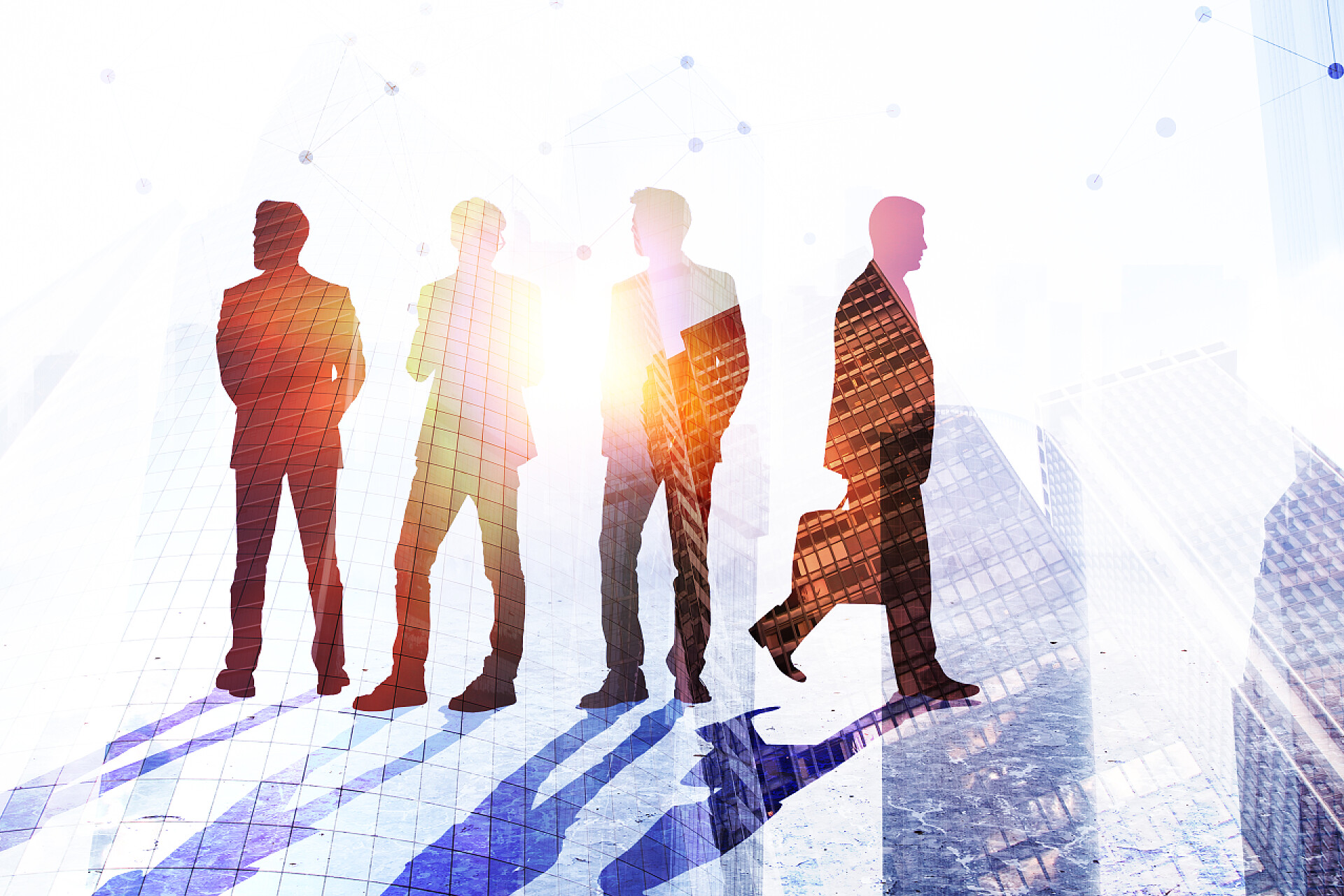 团队合作在城市背景前的商人剪影