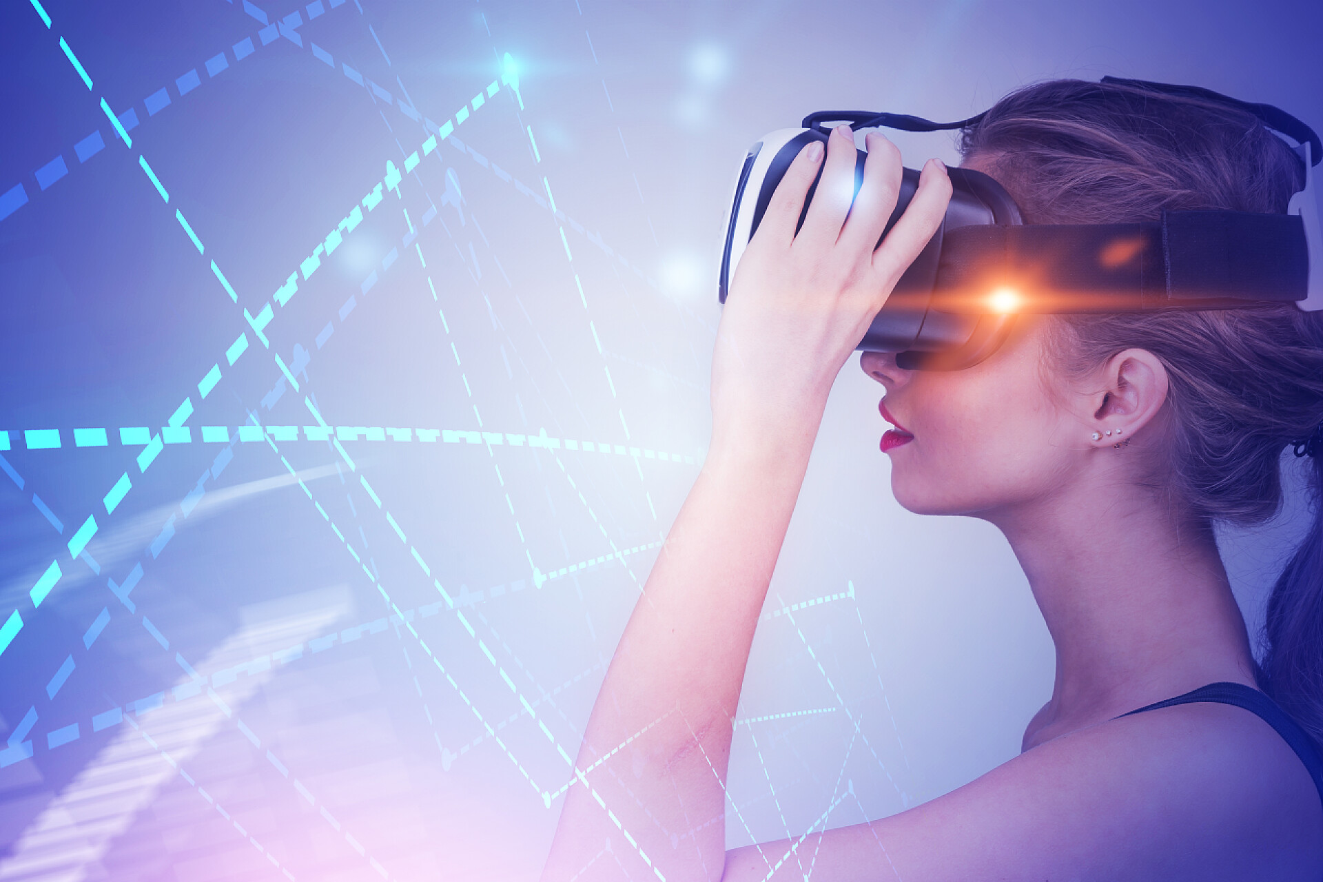 明亮的线条背景中一个美丽的女人戴着VR眼镜现代化科技