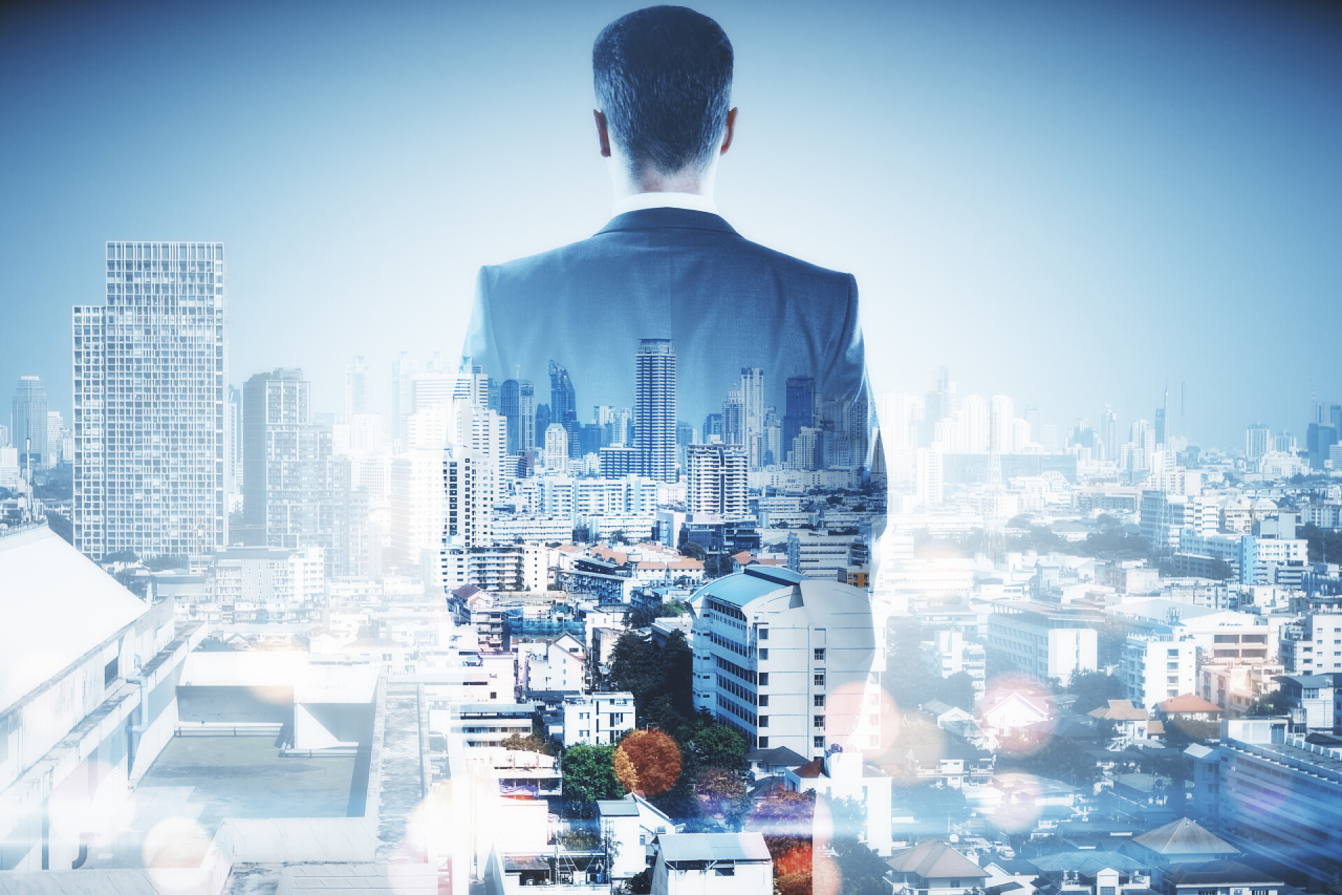 商务城市景观和商人背影融合的背景