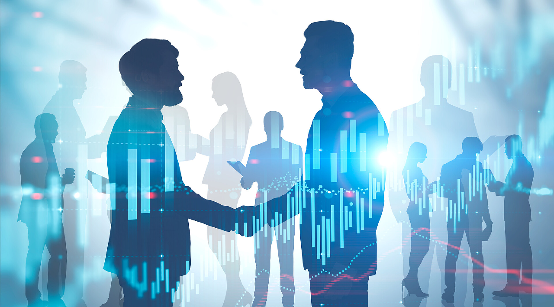 外汇图表背景前握手的商务人士