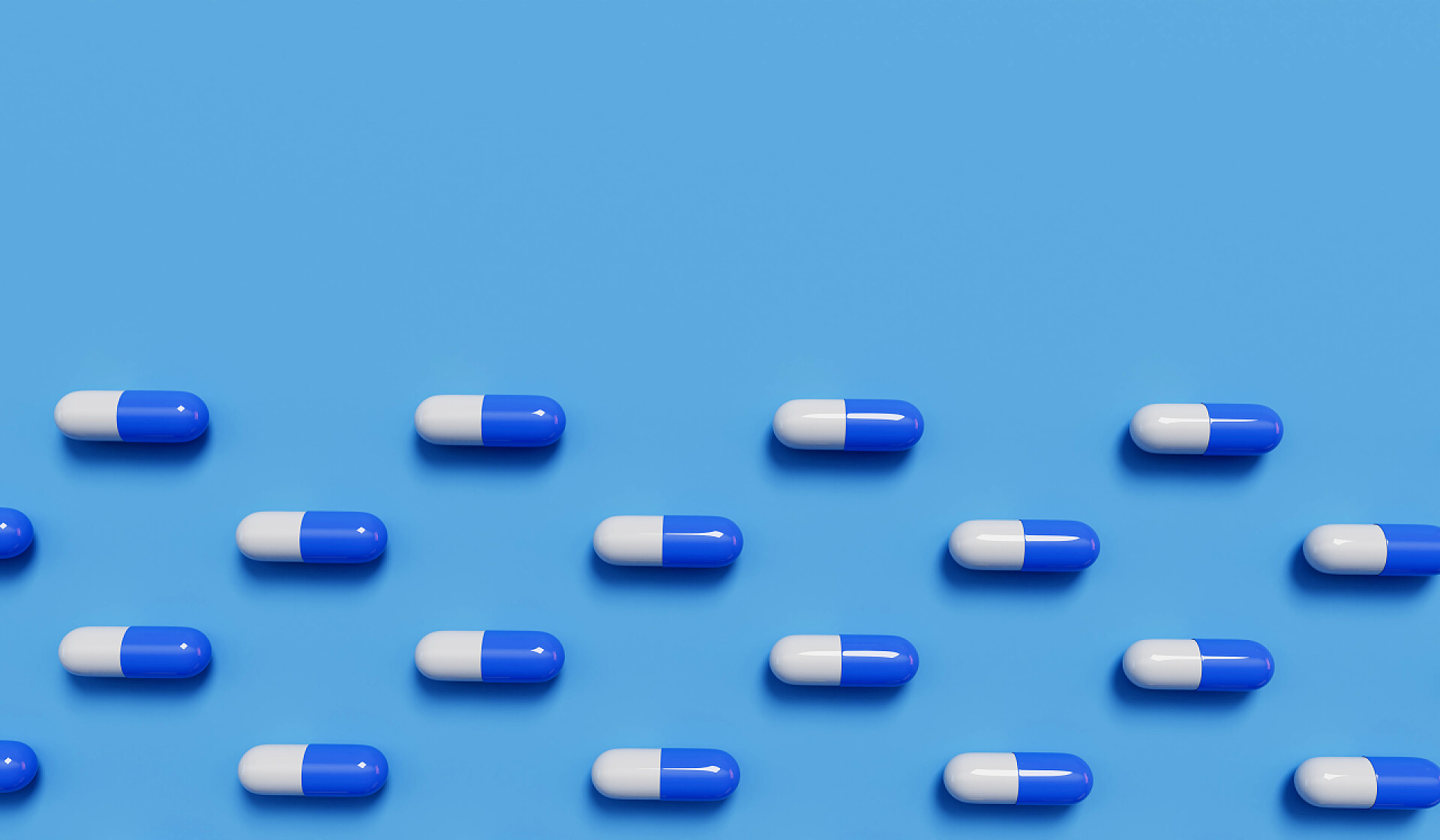 医药医疗蓝色背景的医疗药丸胶囊药品