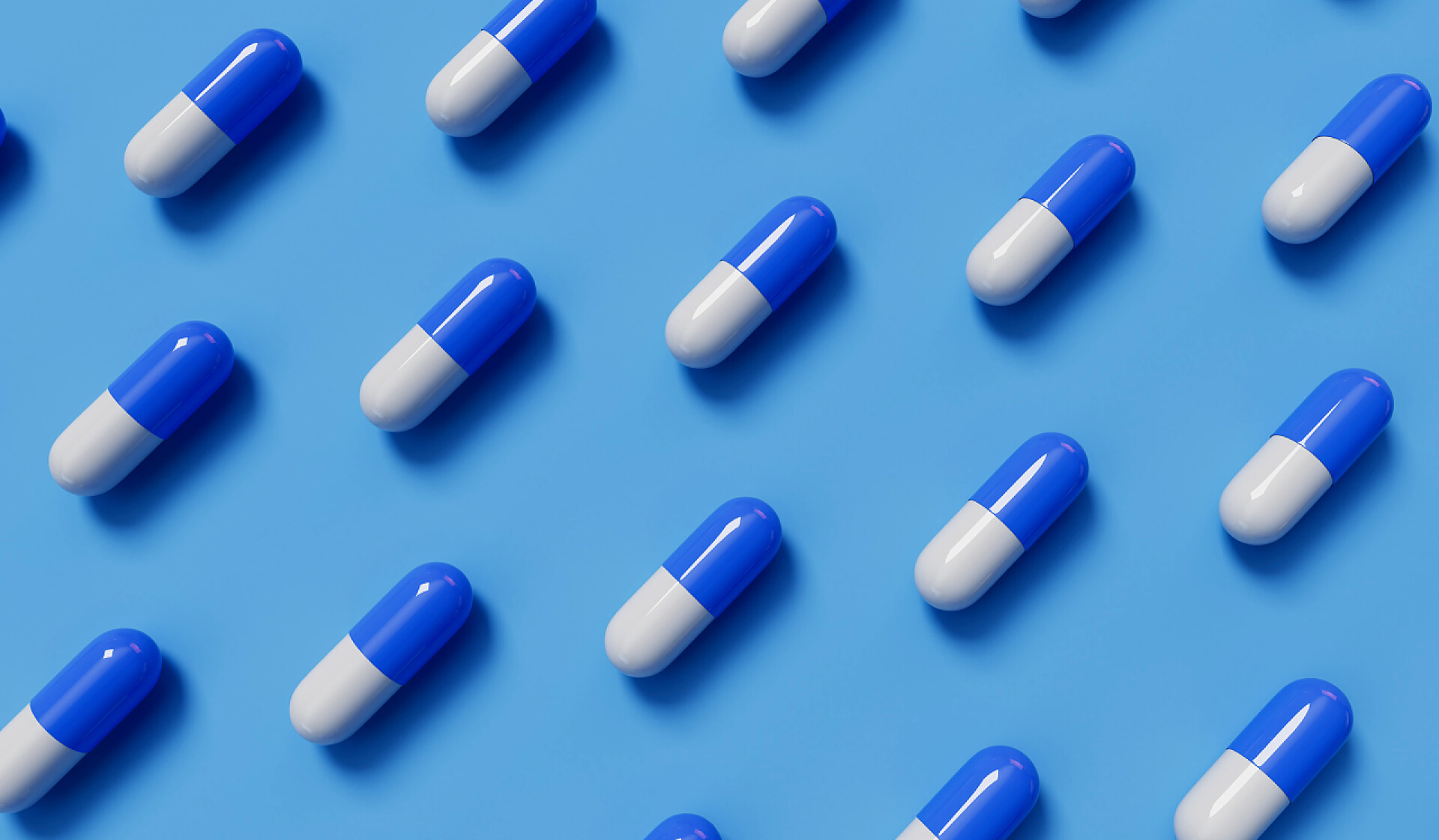 医药医疗蓝色背景的医疗药丸胶囊药品医疗产品
