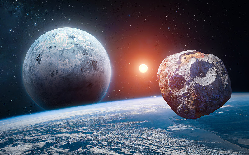 太空中的小行星和行星。在地球轨道上的小行星。科幻概念艺术。这张图片的元素由美国宇航局提供