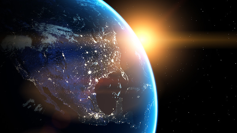 从太空中看到闪耀的城市灯光。美国的观点。世界与阳光从太空升起。