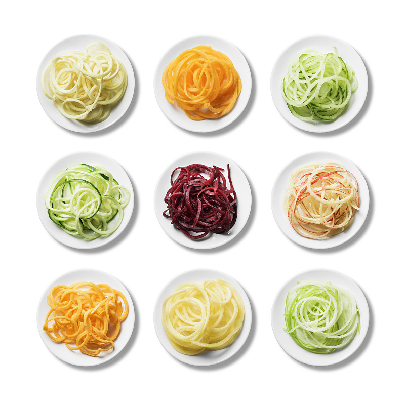 九盘新鲜鲜亮的螺旋形水果和蔬菜