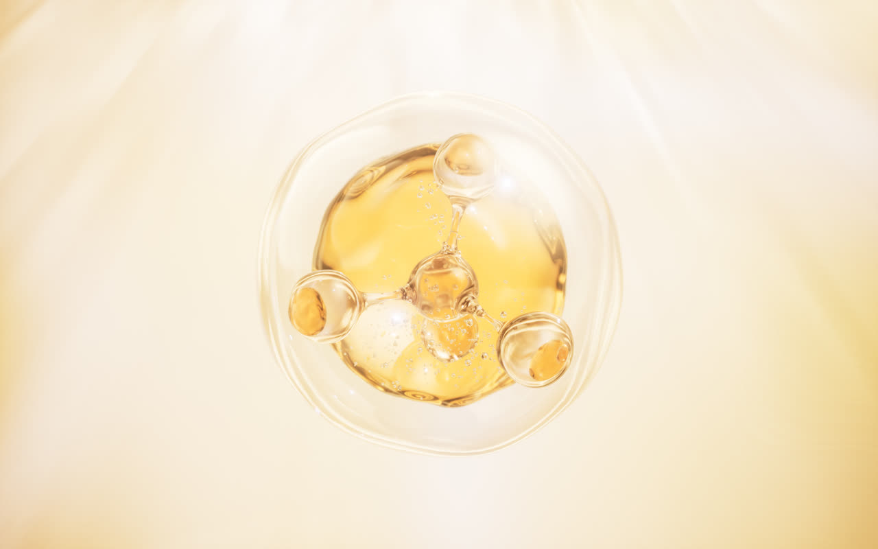 透明分子与金色液滴3D渲染