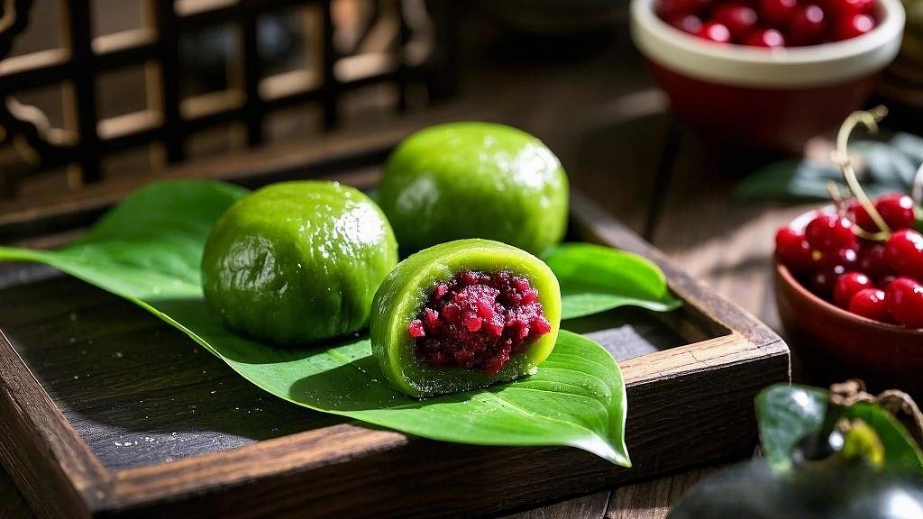 绿叶上摆放着切开露出红豆馅的清明节青团AI