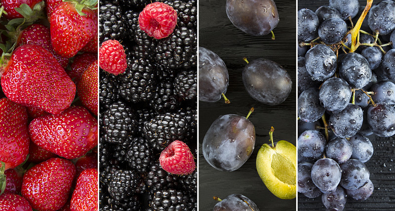 拼贴画水果的背景。特写草莓，黑莓，覆盆子，蓝李子和黑葡萄。