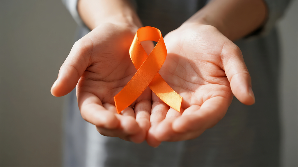 关爱白血病世界癌症日橙色丝带公益背景