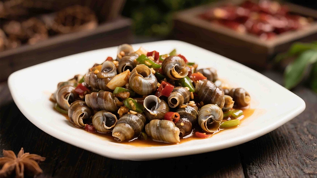 一盘美味的小炒钉螺美食美味海匀